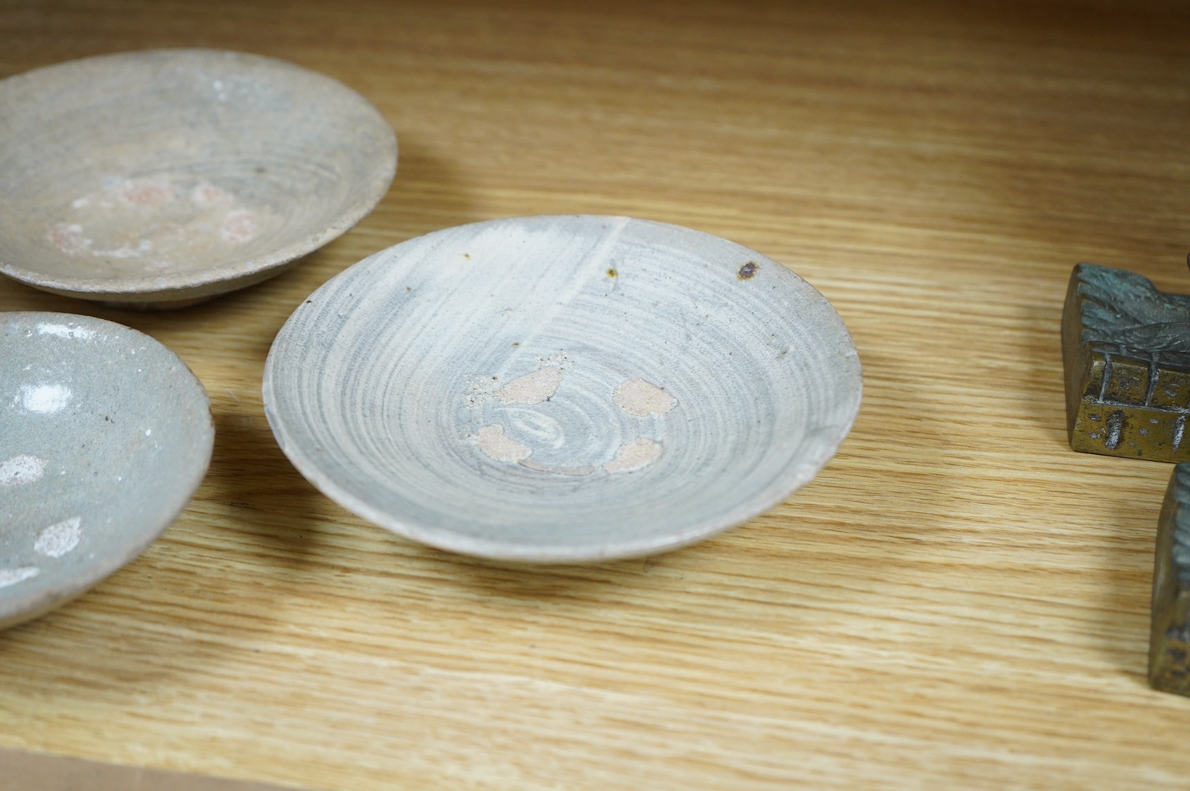 A Korean celadon dish and two Korean Pongchong dishes, Goryeo dynasty, largest 13cm
